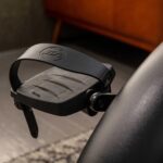 Black footrest attachment for chair.