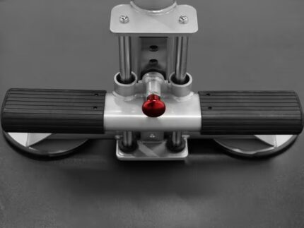 Industrial equipment with handles and red knob.