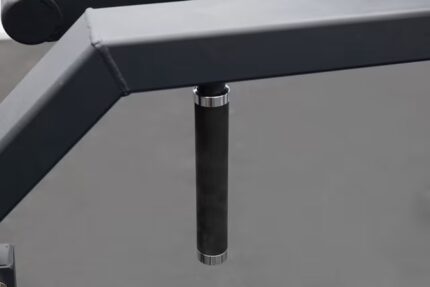 Metal pole on a gray structure.