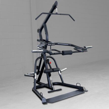 Black multi-station gym equipment in room.