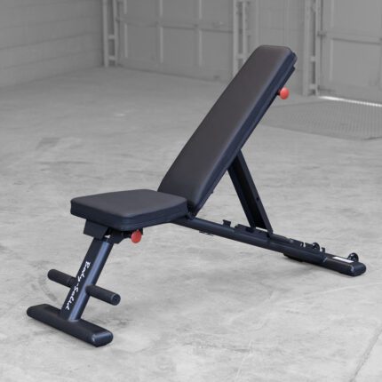 Adjustable weight bench in a garage gym.