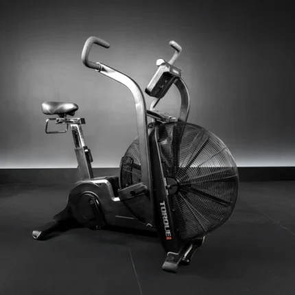 Black exercise bike with large fan wheel.