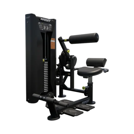 Leg extension exercise machine on black background.