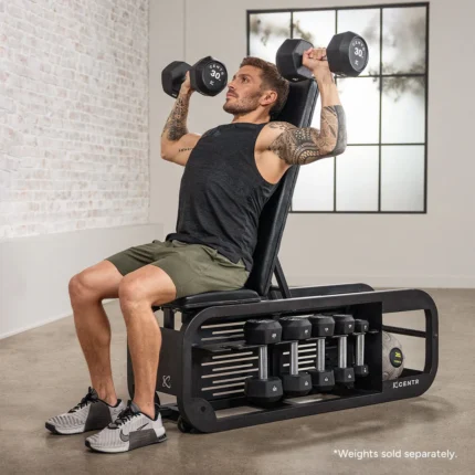 Man lifting dumbbells on exercise bench.