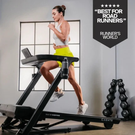 Woman running on a treadmill indoors.