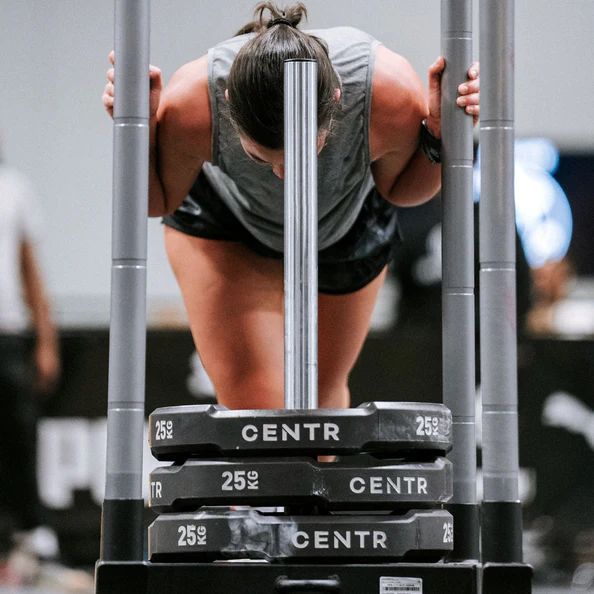Woman lifting weights at the gym. Woman lifting weights at the gym.