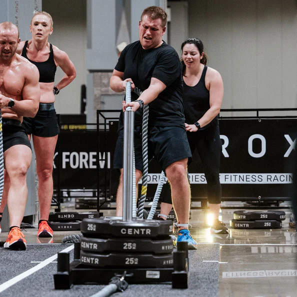 People engaged in intense fitness competition. People engaged in intense fitness competition.
