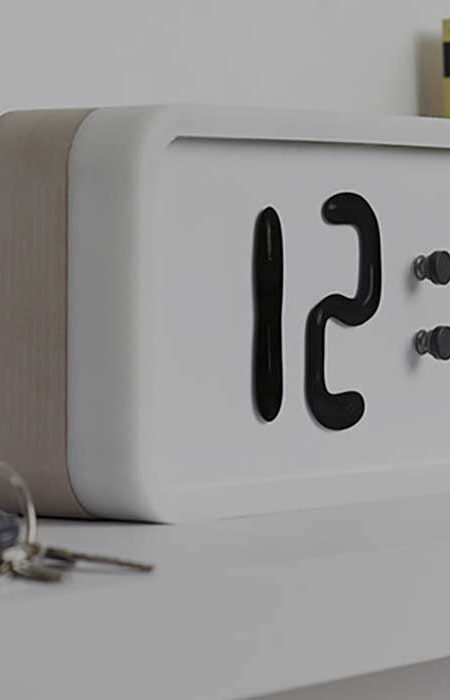 White digital clock showing 12.