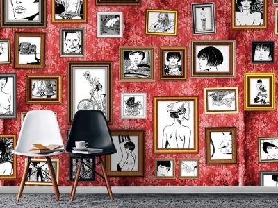 Red wall with framed black and white drawings.