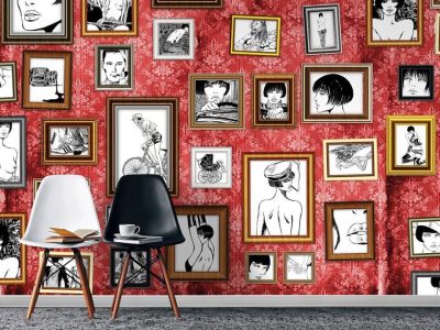 Red wall with framed black and white drawings.