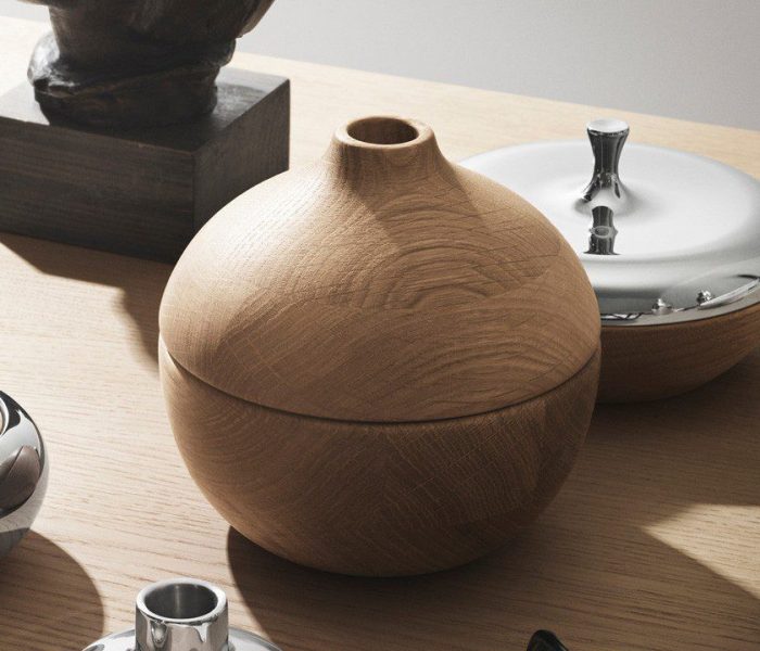 Wooden round box with lid and silver trim.
