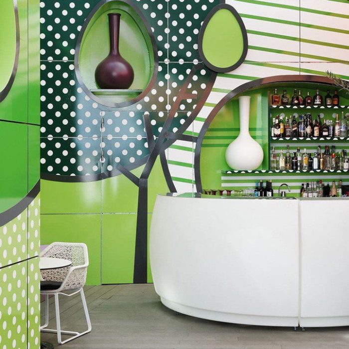 White bar with green and white wall art.